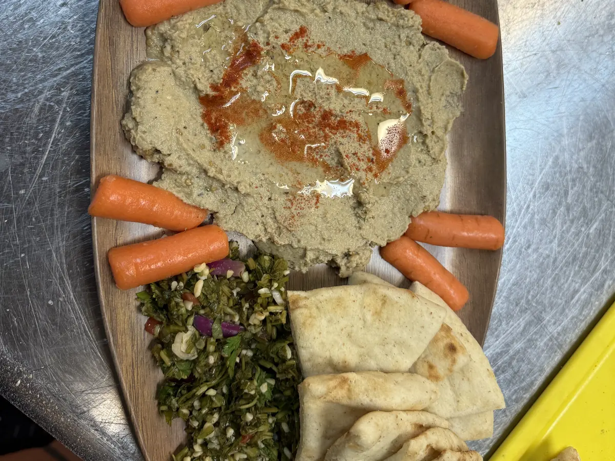 Turkish mezze board at Kaboblicious: hand whipped spreads with olive oil and sumac, tabbouleh, fresh vegetables and warm pita
